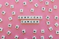 Cervical cancer word made of square letter word on pink background. Royalty Free Stock Photo