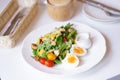 Cesar salad. A closed up of cesar salad with soft focus on the boiled egg. Window light Royalty Free Stock Photo