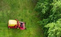 CESKE BUDEJOVICE,CZECH REPUBLIC - Jun 8,2020 - City service worker cutting grass on big mower