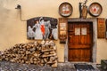 Cesky Krumlov,Czech Republic-March 5,2022.Entrance wooden door to traditional Czech pub.Vintage decorative signs,food and drink