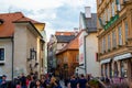 Cesky Krumlov, Czech Republic; 5/18/2019: Street in the old town of Cesky Krumlov with restaurants and typical colorful czech Royalty Free Stock Photo