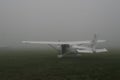 Cessna aircraft in fog Royalty Free Stock Photo