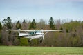Cessna flies over the runway