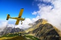 Cessna plane above Carphatian mountain peaks Royalty Free Stock Photo