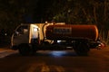 Cesspool truck at work in front of a public toilet of a park in Balashikha, Russia. Royalty Free Stock Photo