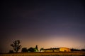 Cestlice, Czech republic - July 22, 2020. Building of shooting range in the field at night with comet C/2020 F3 Neowise above