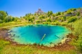 Cetina river source water hole and Orthodox church on the hill view Royalty Free Stock Photo