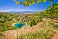 Cetina river source water hole and Orthodox church view Royalty Free Stock Photo