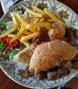 Cevapcici with fries and ajvar, minced meat