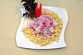 Ceviche, a dish of raw fish, cooked and accompanied by corn from the cuisine of Peru Royalty Free Stock Photo