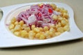 Ceviche, a dish of raw fish, cooked with lemon and accompanied by corn from the cuisine Royalty Free Stock Photo