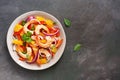 Ceviche salad with shrimps and oranges on a dark rustic background. Latin American food. Top view, flat lay, copy space Royalty Free Stock Photo