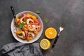 Ceviche salad with shrimps and oranges on a dark rustic background. Latin American food. Top view, flat lay, copy space Royalty Free Stock Photo