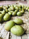 Ceylon Olive (Veralu) fruits in a traditional reed mat