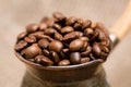 Cezve with roasted coffee beans on sackcloth Royalty Free Stock Photo
