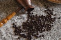 Cezve with spilled coffee beans and pancakes with boiled potatoes in the background Royalty Free Stock Photo