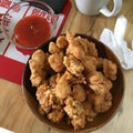 CFC chicken pop with Chili sauce on the table