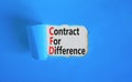 CFD symbol. Concept words CFD contract of difference on beautiful white paper. Beautiful blue table blue background. Business and Royalty Free Stock Photo