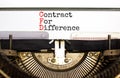 CFD symbol. Concept words CFD contract of difference typed on beautiful retro old typewriter. Beautiful white background. Business Royalty Free Stock Photo