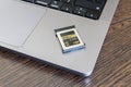 CFexpress memory card lies on a laptop. Royalty Free Stock Photo