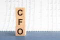 CFO - Chief Financial Officer - acronym on wooden cubes on grey backround. Business concept