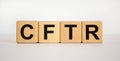 CFTR medical concept. Wooden cubes with the inscription `CFTR - cystic fibrosis transmembrane regulator`. Beautiful white Royalty Free Stock Photo