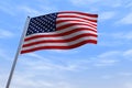 CGI isolated USA flag waving on a blue sly - close up of United States of America national flag flowing in the wind in US American