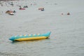 Cha-am / Thailand - April 20 2019 - wet and trilling banana boat water sport on sea for tourist
