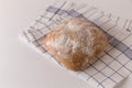 Chabata bread fresh on towel on white background Royalty Free Stock Photo