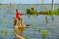 Fisherboy fishing by using fishing pole to fish