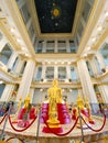 Many people pray respect Golden Buddha statue inside