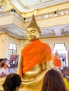Many people pray respect Golden Buddha statue inside