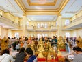 Many people pray respect Golden Buddha statue inside