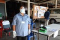 Village health volunteers screening voters to prevent the spread of COVID-19