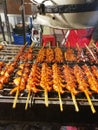 Chacoal grilled chicken wings and offal in sticks with hood above
