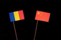 Chad flag with Chinese flag isolated on black