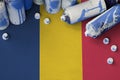 Chad flag and few used aerosol spray cans for graffiti painting. Street art culture concept Royalty Free Stock Photo