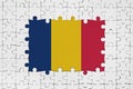 Chad flag in frame of white puzzle pieces with missing central part Royalty Free Stock Photo