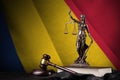 Chad flag with statue of lady justice, constitution and judge hammer on black drapery. Concept of judgement and guilt Royalty Free Stock Photo