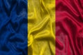 Chad national flag background with fabric texture. Flag of Chad waving in the wind. 3D illustration