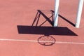 Chadow of basketball hoop at the red playground