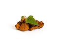 Chaga mushroom pieces isolated on a white background. Chopped chaga and birch green leaf