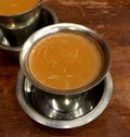Chai Masala with Fresh cow milk on brown wooden table