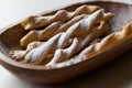 Chai Spiced Russian Twig Sweet Crackers with Powdered Sugar in Wooden Bowl. Royalty Free Stock Photo