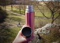 Chailling in a park wiht a thermos mug Royalty Free Stock Photo