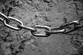 Chain on the background of the old concrete wall Royalty Free Stock Photo