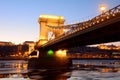 The Chain Bridge at sunset over the icy Danube River, Budapest, Royalty Free Stock Photo