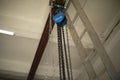 Chain on ceiling. Chains hang on steel beam