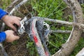 Biker changing his broken bike chain Royalty Free Stock Photo