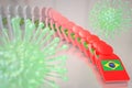 Viruses and falling dominoes with flag of Brazil. Coronavirus spread conceptual 3D rendering